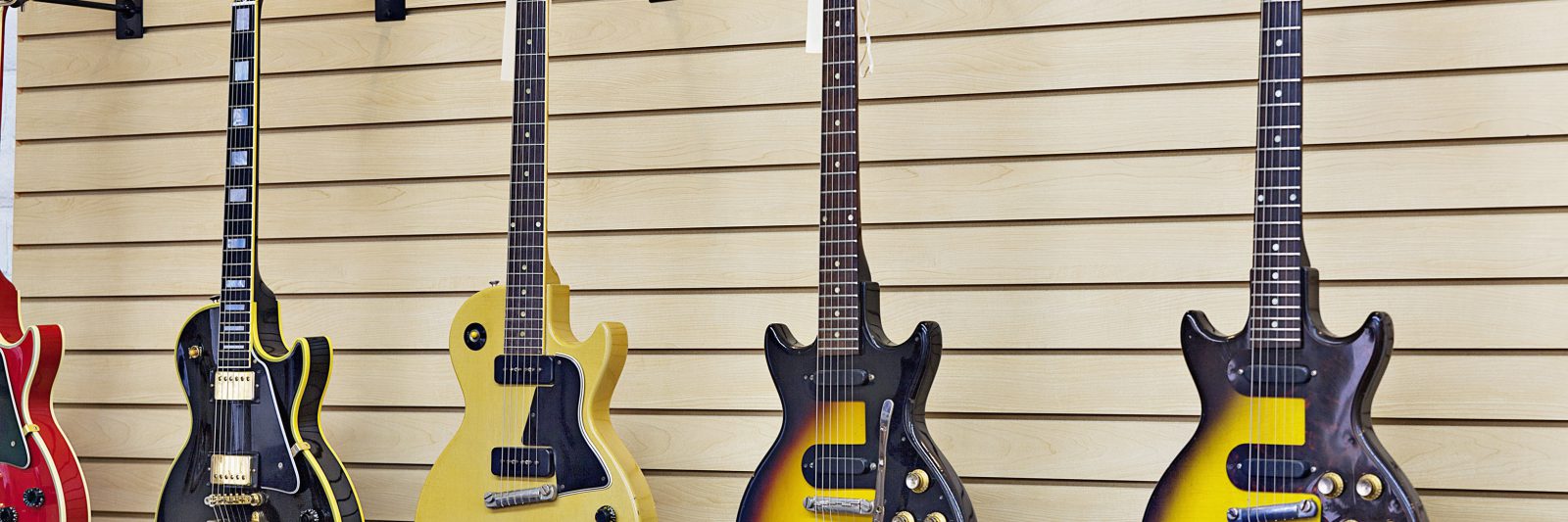 guitars hanging on wall