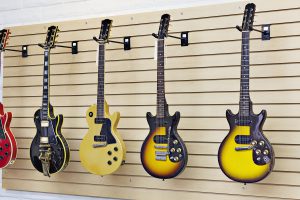 guitars hanging on wall